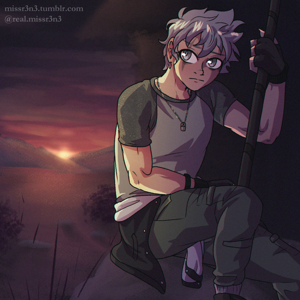 malo from rad mad venture sitting on a boulder beside a house with his back turned to the sunrise